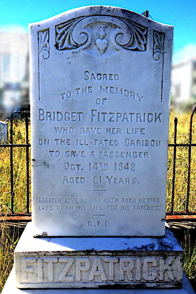 White gravestone in cemetery