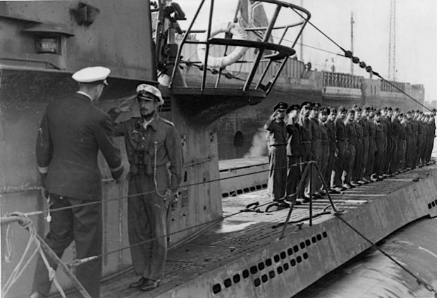 U-boat commander saluting German Navy officer on deck of U-boat