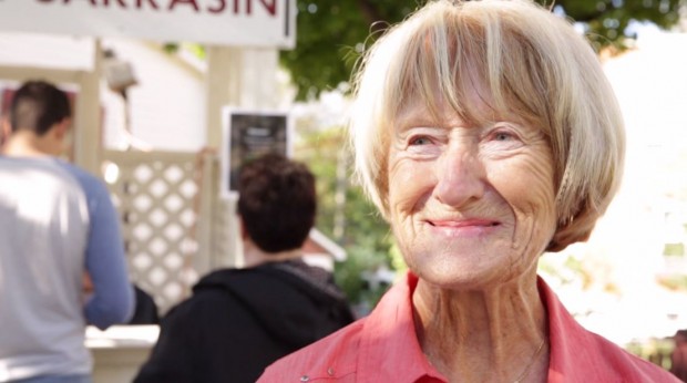 Close-up of Huguette Désormeaux with short blonde hair, smiling at the camera.