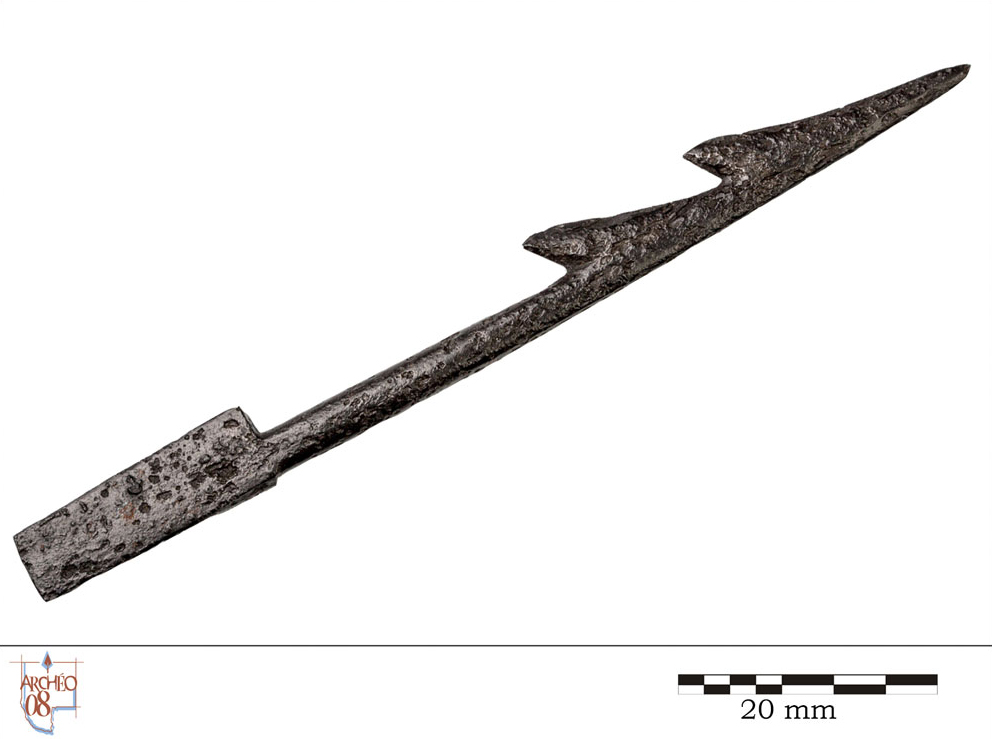 A spear-shaped instrument with a line attached.