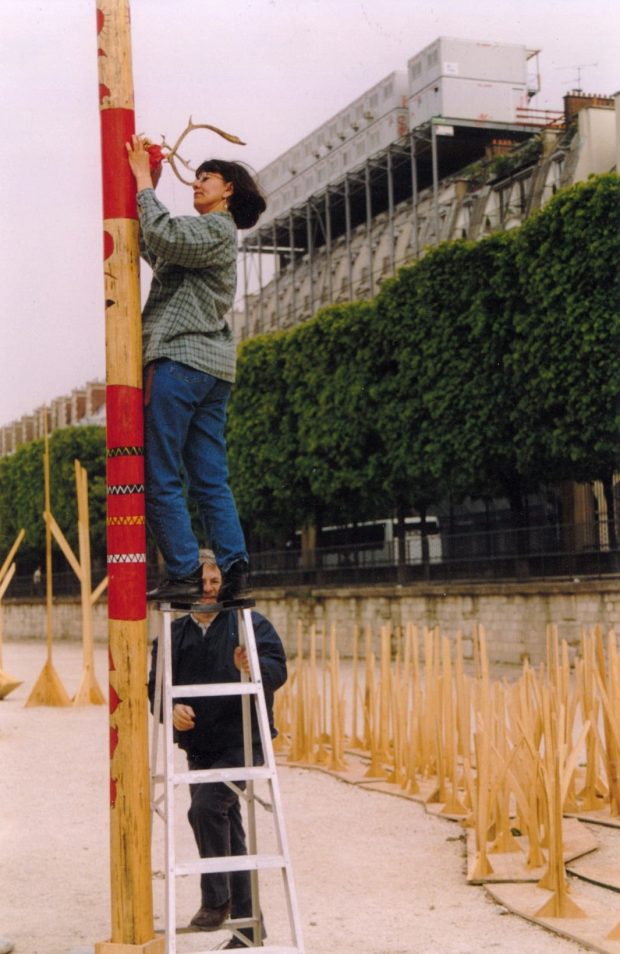 Photograph of artist Virginia Pésémapeo Bordeleau at work.