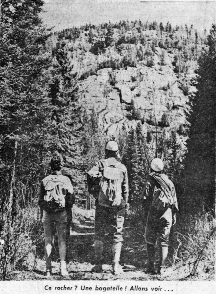 Three climbers in the forest with their equipment, looking towards Mont Césaire.