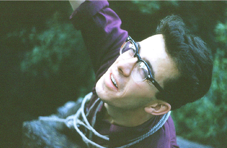 Close-up of a climber wearing glasses.