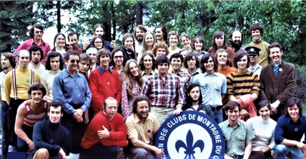 Colour photograph of some 50 people tightly grouped in ranks.