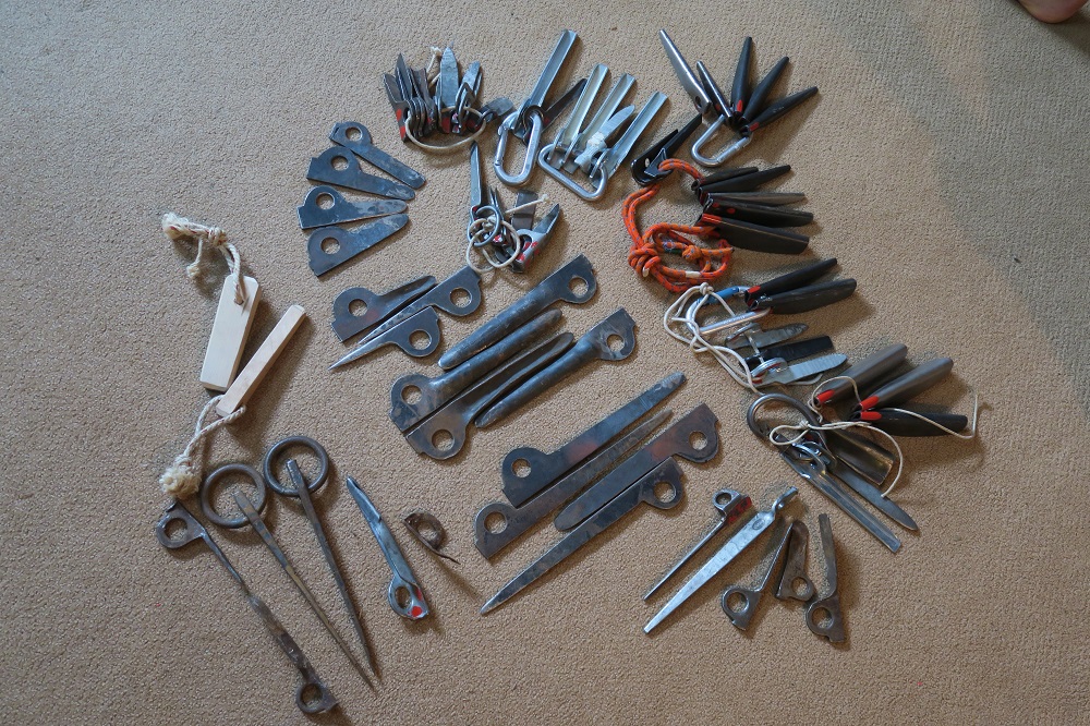Various metal parts that can be fixed in the rock in order to secure a climber during the ascent.