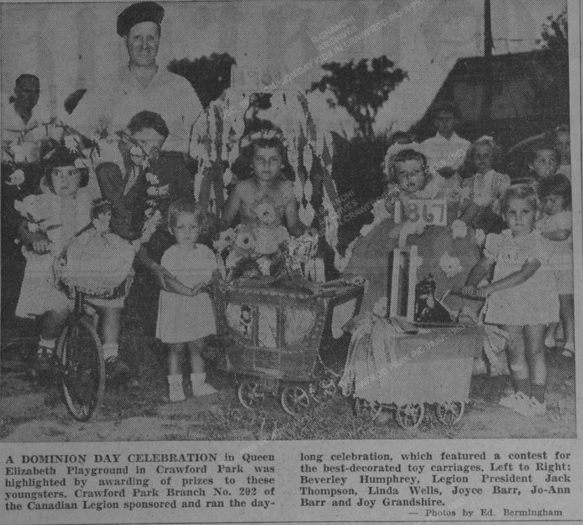 Black and white newspaper article featuring a photograph of two men standing with a dozen children in front of them and to their right. In the foreground, a bicycle and two toy baby carriages. In the background, some trees and a building. Below, a 60-word text.