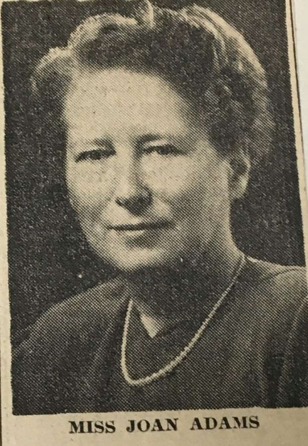 Black and white portrait framing a woman’s head and shoulders published in a newspaper.