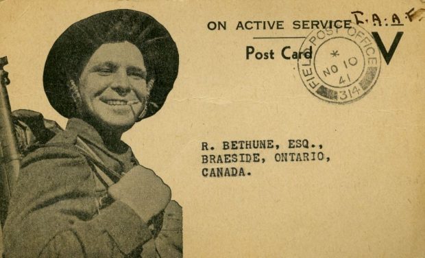 A WWII soldier grinning with a cigarette in his mouth illustrates the front of a stamped post card addressed to R. Bethune, Esquire, Braeside, Ontario, Canada.