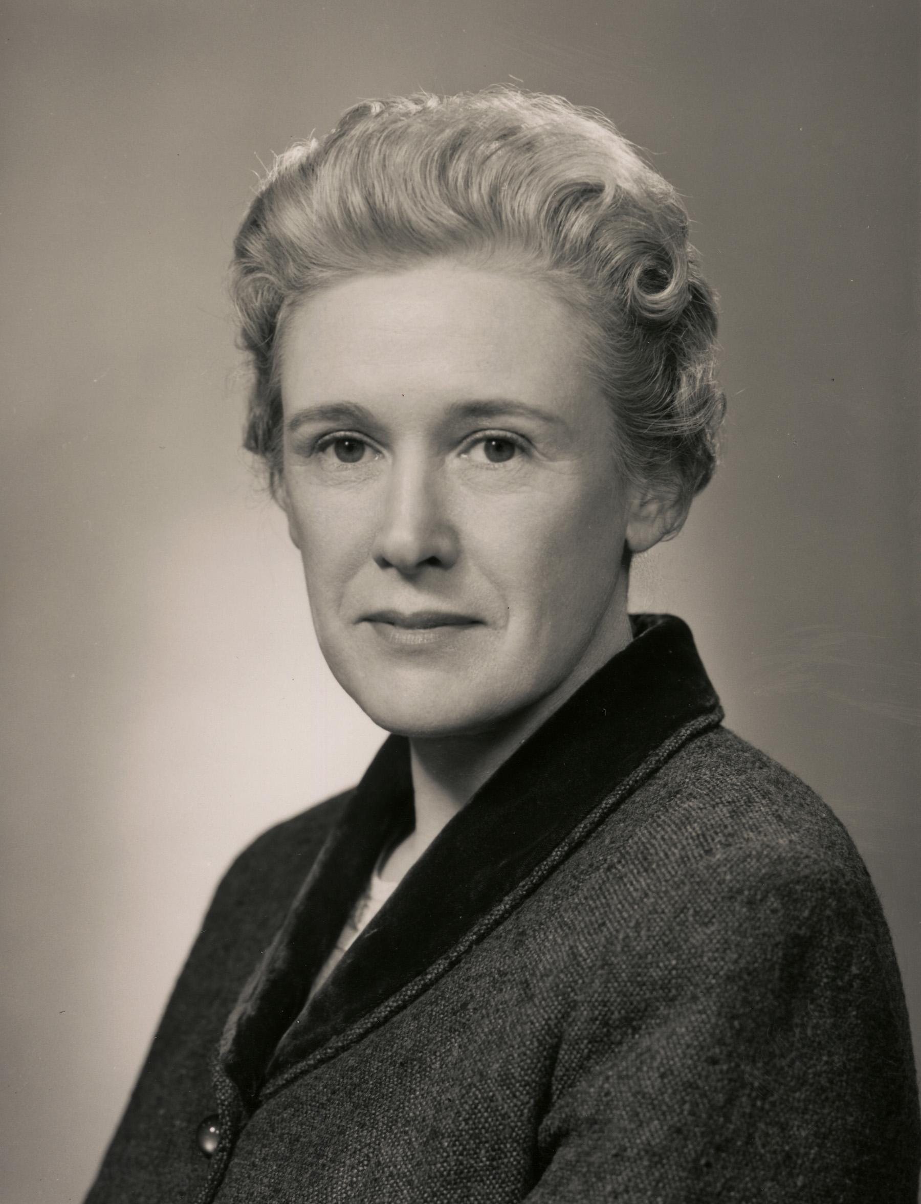 A black and white portrait of a woman.