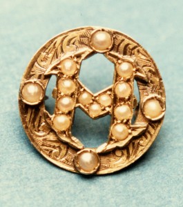 Small golden pin.