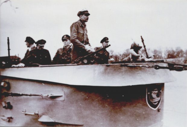 photo of German U-boat crew standing on the bridge of their submarine