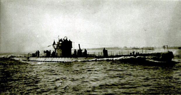 German U-boat at sea with some crew standing on deck