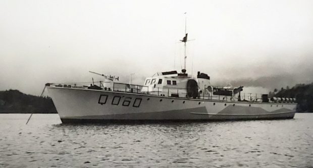 small Navy patrol boat at anchor