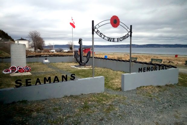 Seaman's Memorial with stone monument, anchor, Canadian flag and gateway with Lest We Forget and a poppy