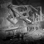 Electric shovel loading iron ore into ore car at Bell Island