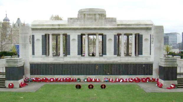 large stone memorial with a colonnade and bronze plaques listing the names of dead Merchant Navy sailors