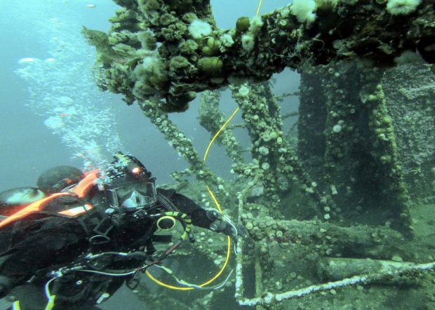 Navy diver underwater on Rose Castle shipwreck