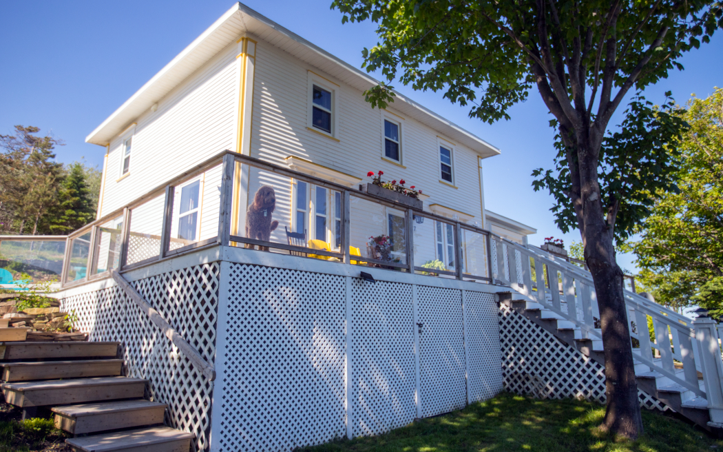 white clapboard two-storey house