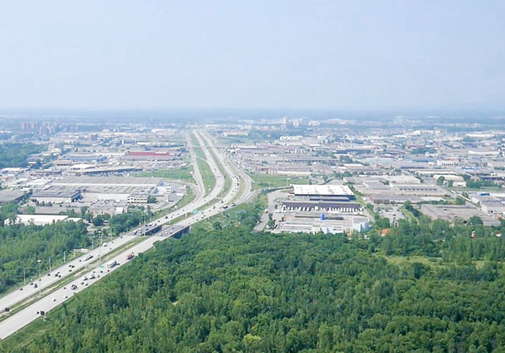 Aerial colour photograph: View of Jean-Noël Lavoie Highway and the industrial sector of Laval.